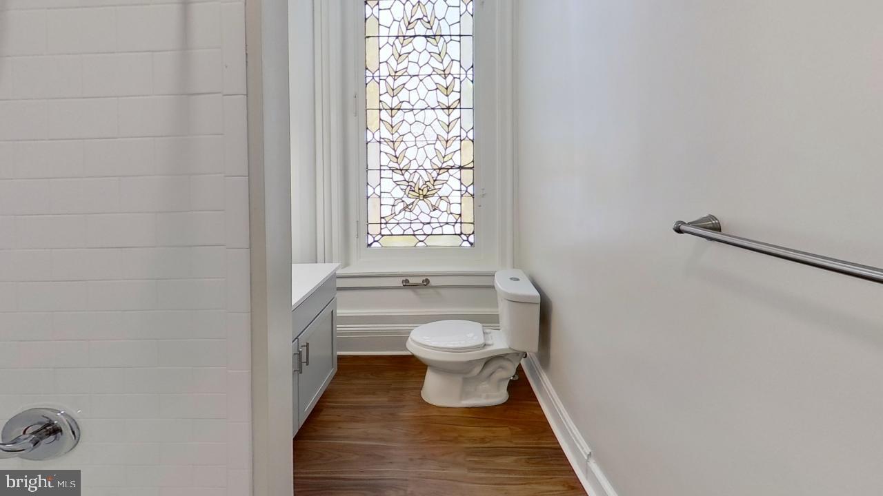 10 East Chase Street Baltimore, MD 21202 - Photo 42 of 60 a bathroom with a toilet and a shower