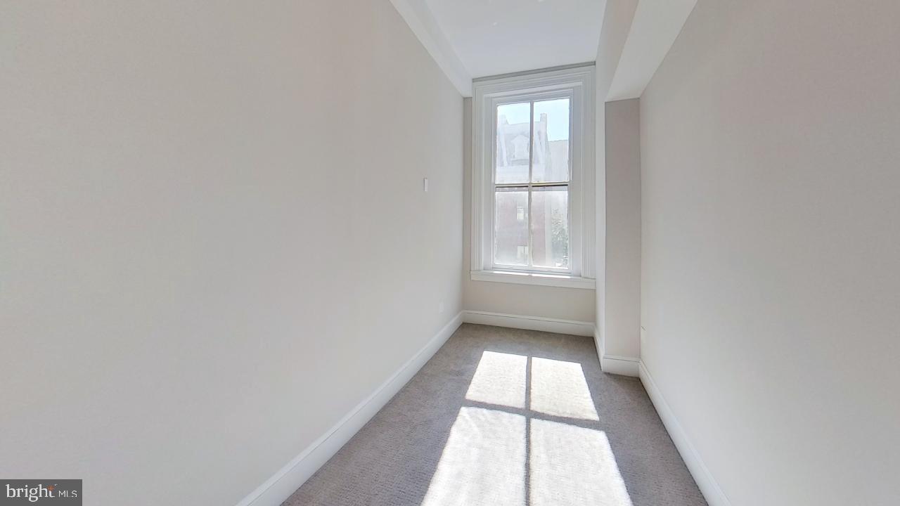 10 East Chase Street Baltimore, MD 21202 - Photo 50 of 60 a view of an empty room and a window