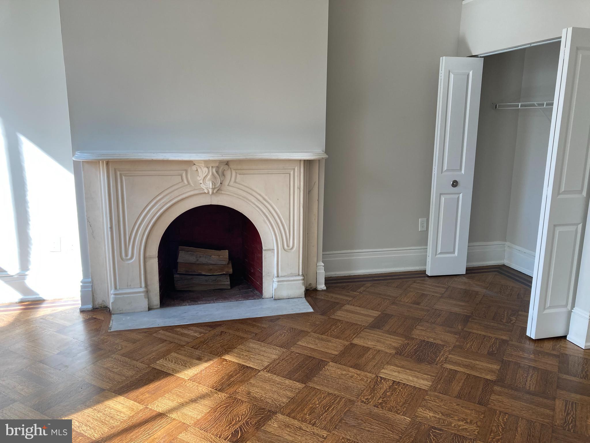 10 East Chase Street Baltimore, MD 21202 - Photo 7 of 60 a view of kitchen with a fireplace and entryway