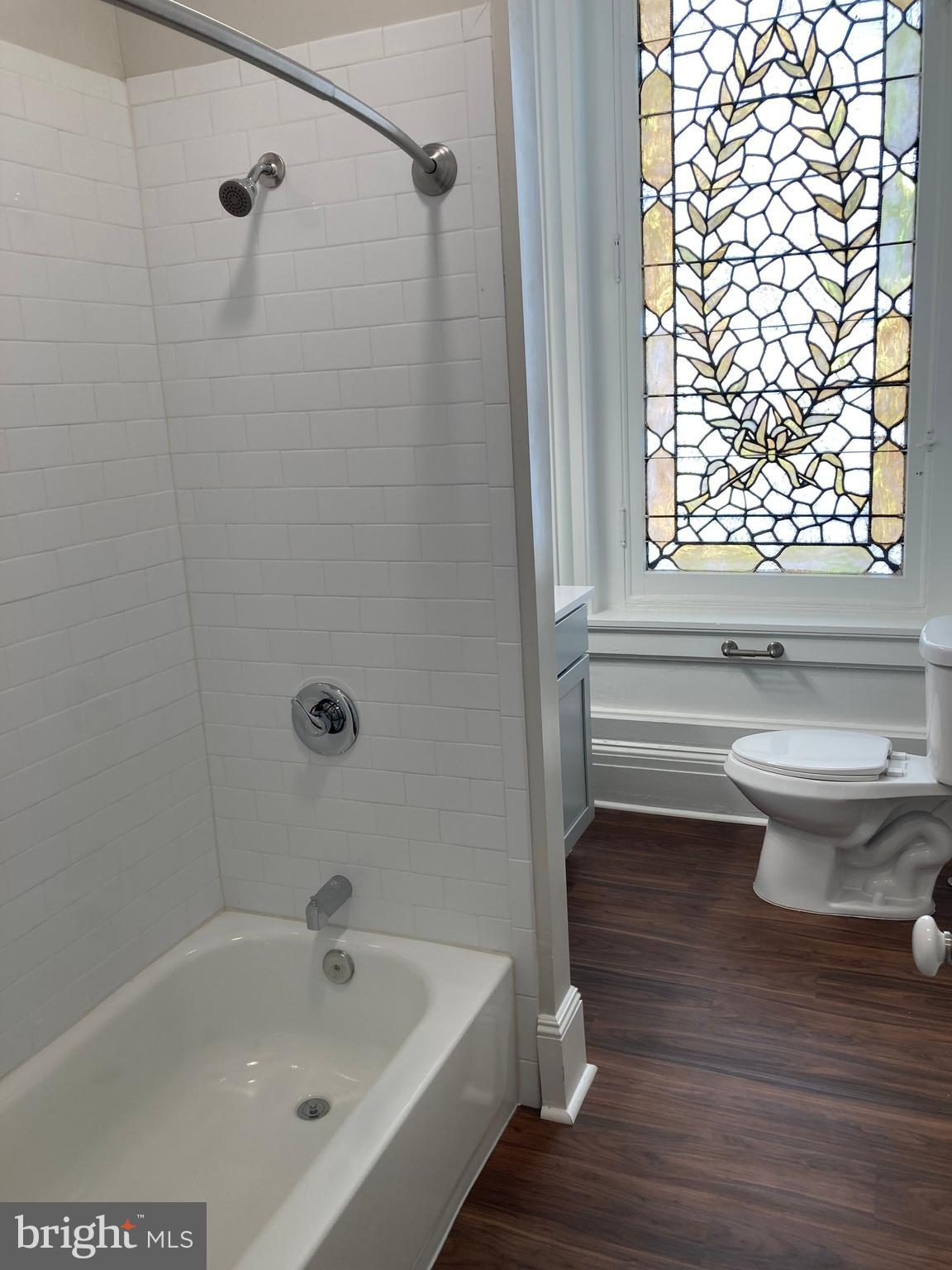 10 East Chase Street Baltimore, MD 21202 - Photo 9 of 60 a bathroom with a sink and a bathtub