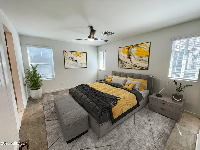 a bedroom with bed and window