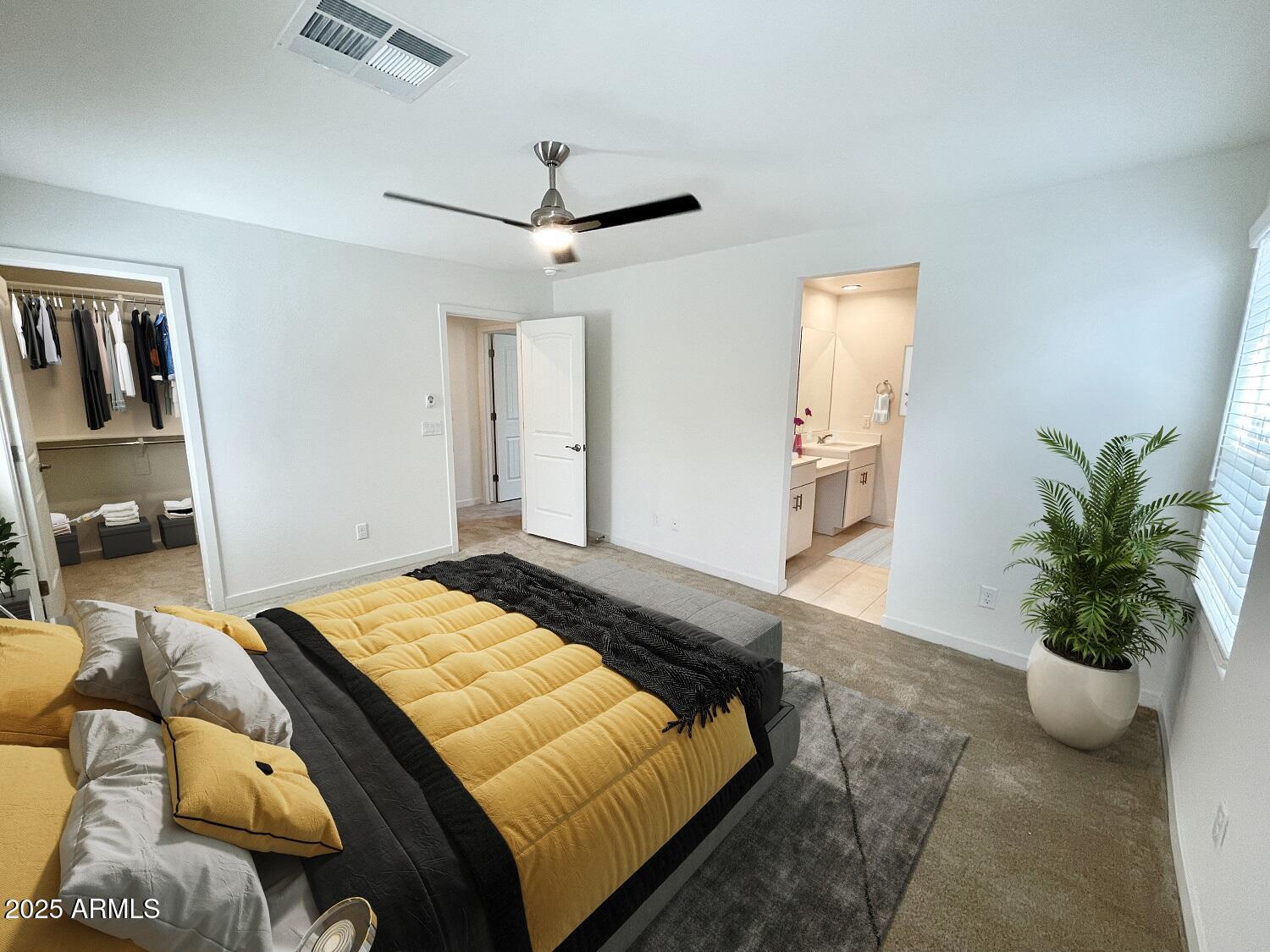 814 East Roma Avenue, Unit 2 Phoenix, AZ 85014 - Photo 14 of 20 a bedroom with a bed and a potted plant