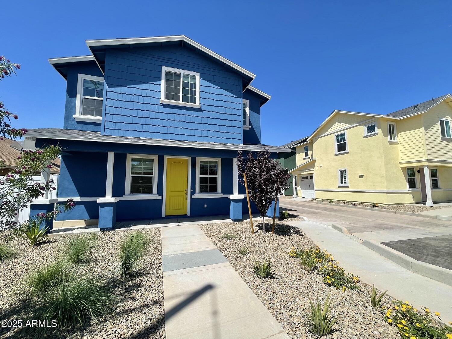 814 East Roma Avenue, Unit 2 Phoenix, AZ 85014 - Photo 2 of 20 a front view of a house with a yard