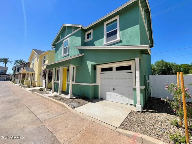 a front view of a house with a garage