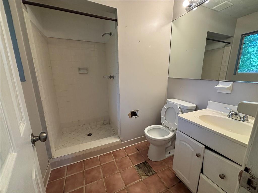 4135 Moore Road Conley, GA 30288 - Photo 5 of 10 a bathroom with a sink toilet and shower