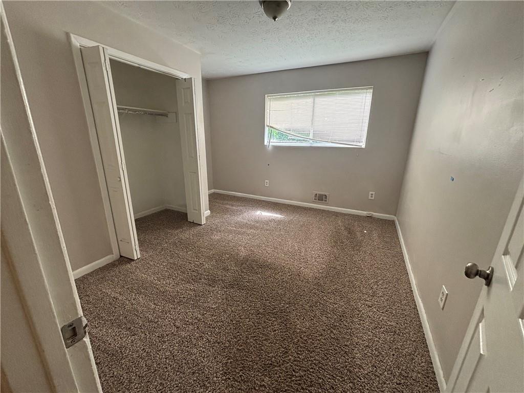 4135 Moore Road Conley, GA 30288 - Photo 7 of 10 an empty room with windows