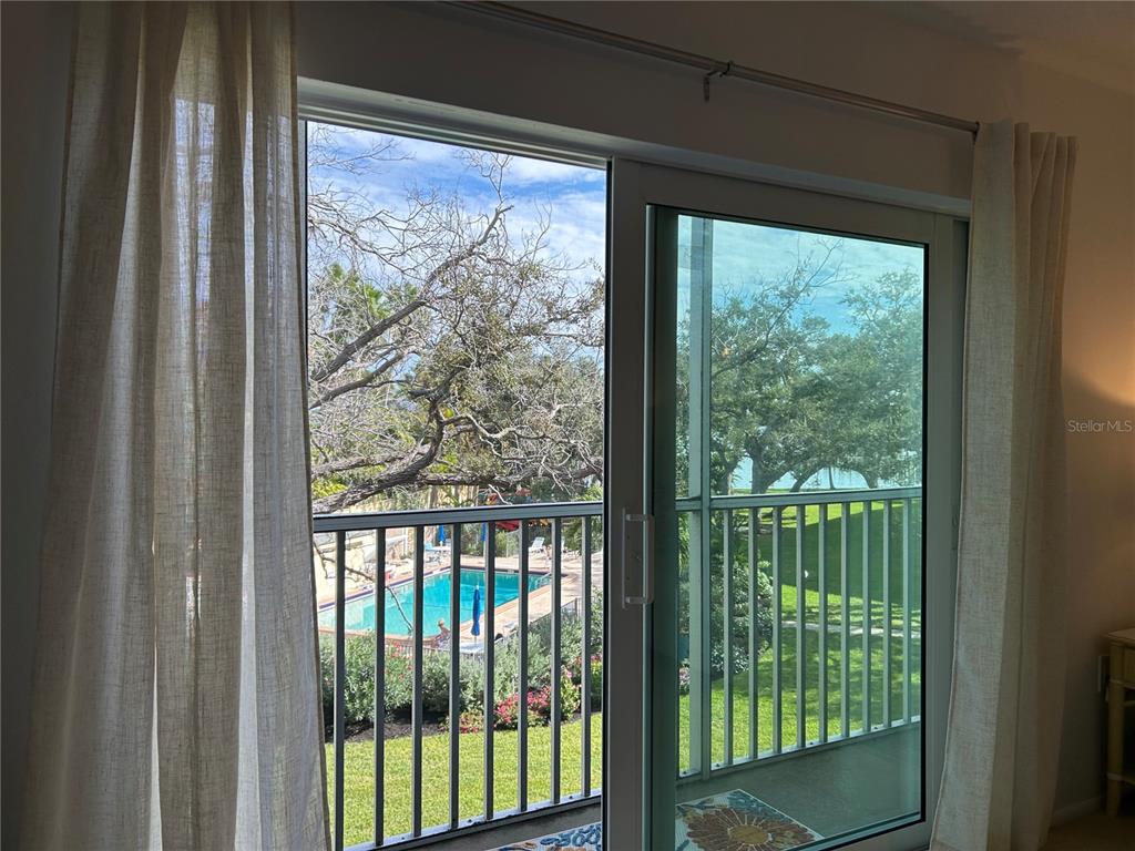 8625 Midnight Pass Road, Unit 305B Sarasota, FL 34242 - Photo 14 of 38 a view of a room with a large window