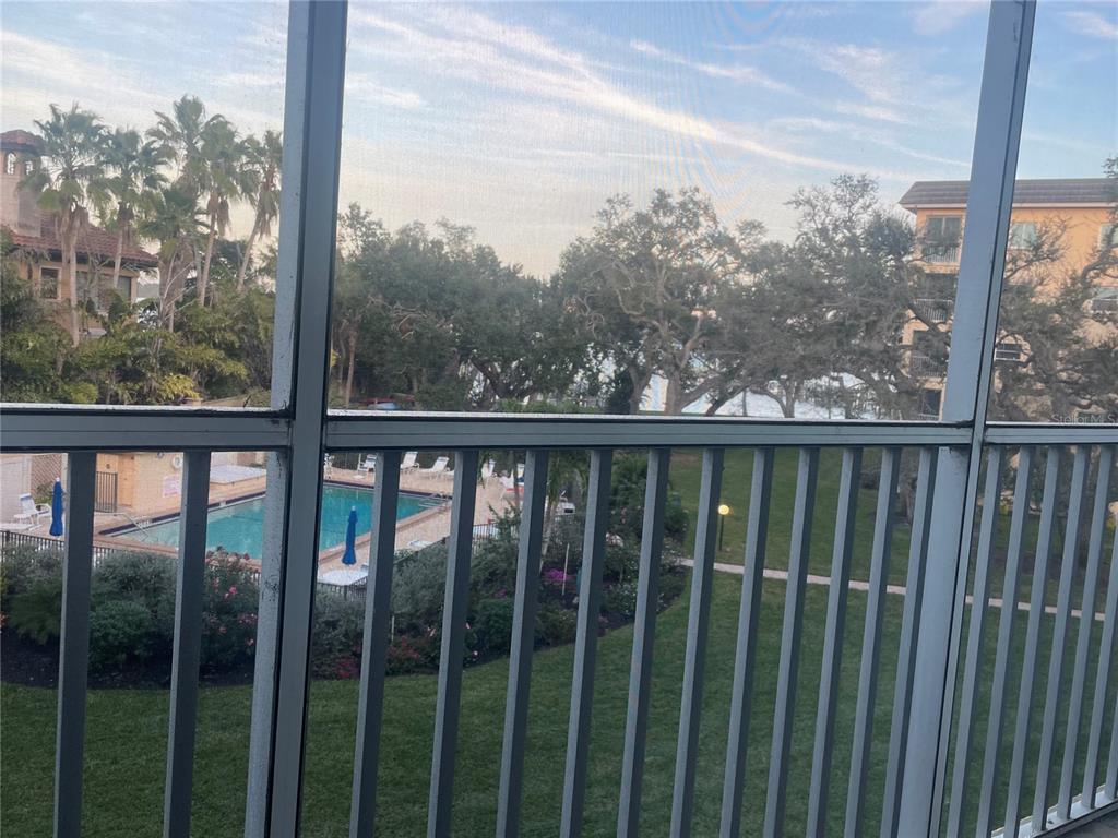 8625 Midnight Pass Road, Unit 305B Sarasota, FL 34242 - Photo 15 of 38 a view of a forest from a balcony
