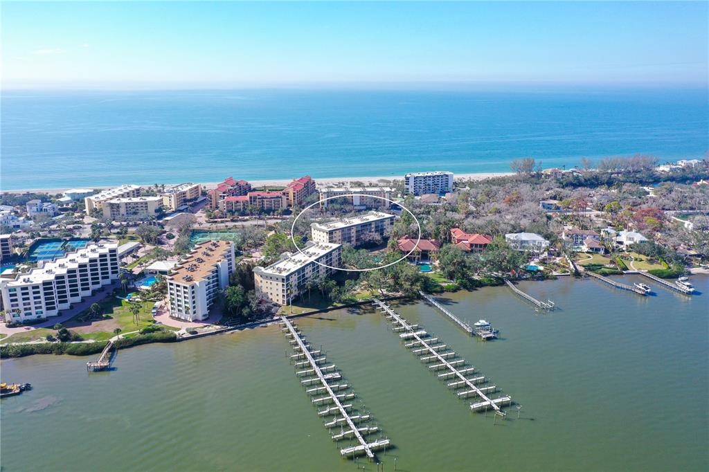 8625 Midnight Pass Road, Unit 305B Sarasota, FL 34242 - Photo 29 of 38 an aerial view of a city with ocean view