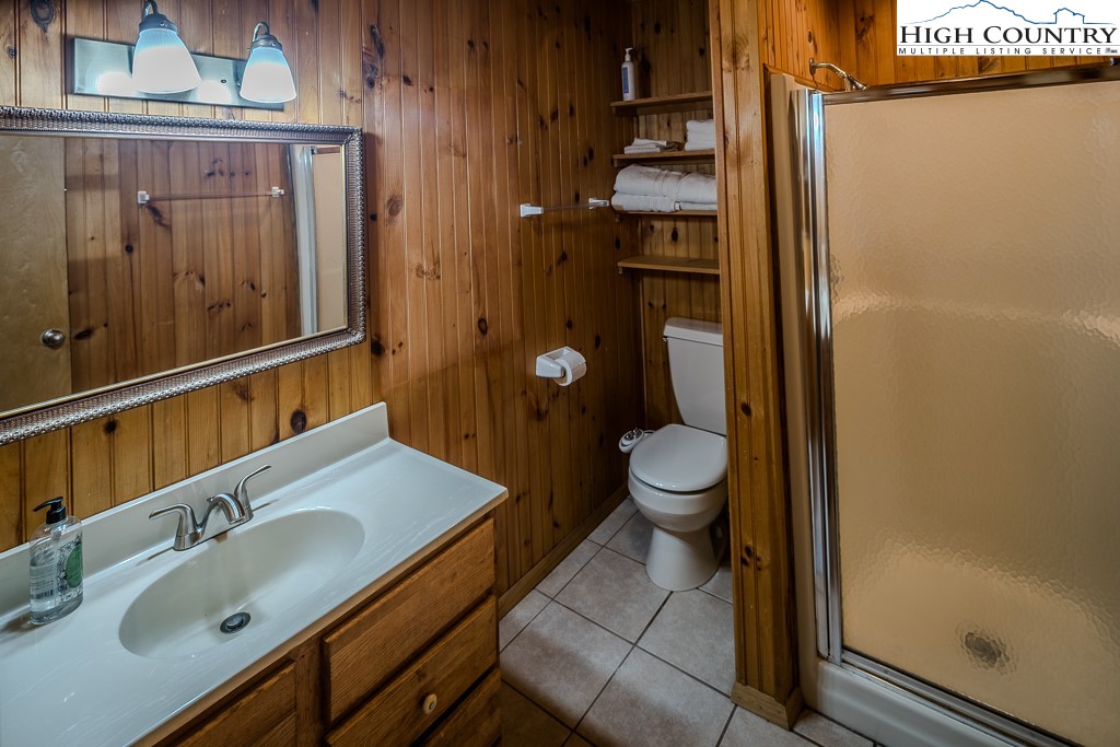 80 Avery Co High School Road Newland, NC 28657 - Photo 11 of 36 a bathroom with a sink a toilet and shower