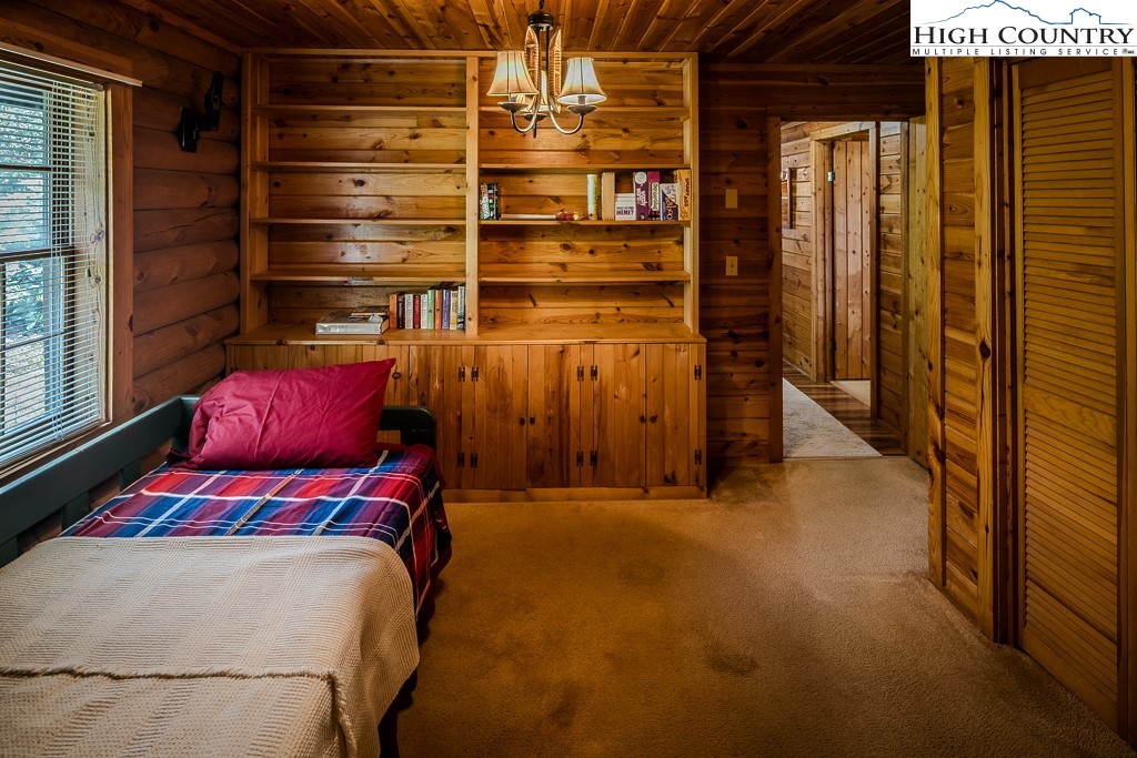 80 Avery Co High School Road Newland, NC 28657 - Photo 17 of 36 a bedroom with a bed and a window
