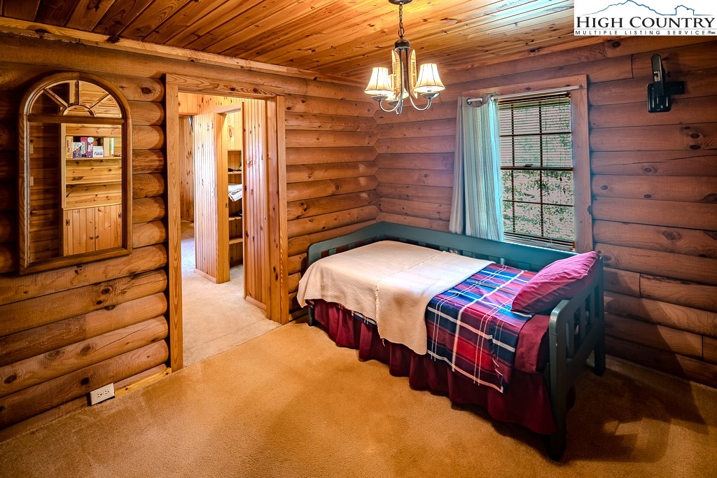 80 Avery Co High School Road Newland, NC 28657 - Photo 18 of 36 a bedroom with a bed and a window