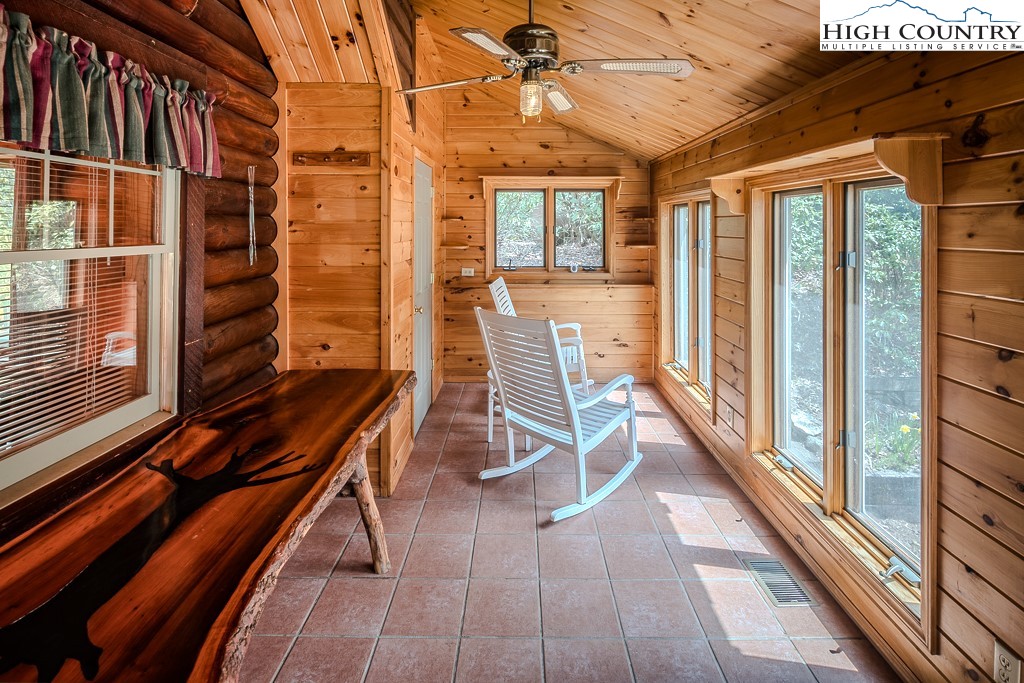 80 Avery Co High School Road Newland, NC 28657 - Photo 23 of 36 a balcony with chairs and wooden floor