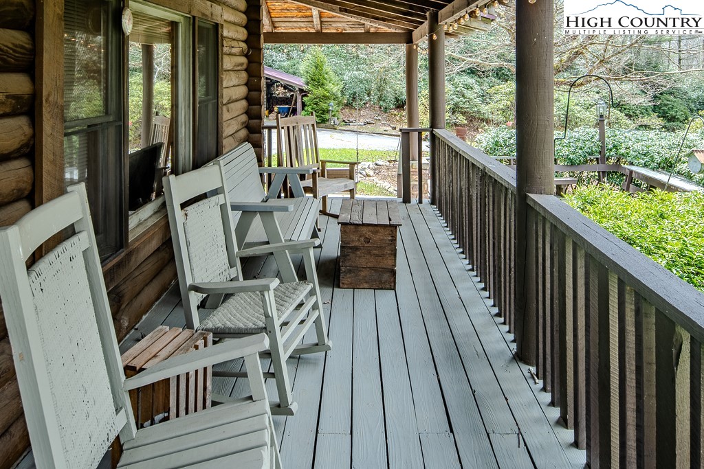 80 Avery Co High School Road Newland, NC 28657 - Photo 26 of 36 a view of balcony with wooden floor and outdoor seating