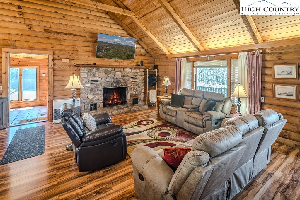 80 Avery Co High School Road Newland, NC 28657 - Photo 4 of 36 a living room with furniture a fireplace and a table