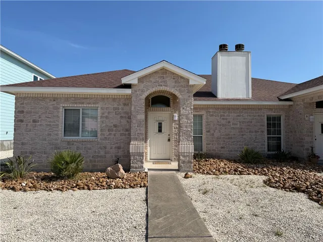 a front view of a house with yard