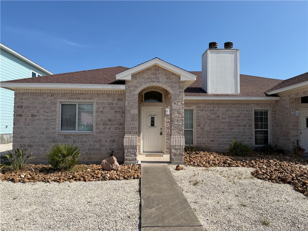 a front view of a house with yard