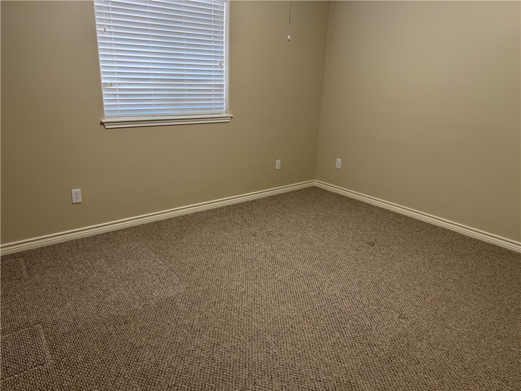 15210 Cruiser Street Corpus Christi, TX 78418 - Photo 11 of 12 an empty room with a window