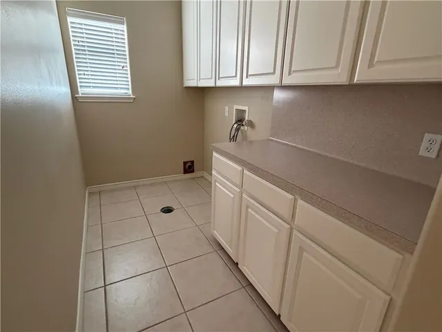 a utility room with cabinets