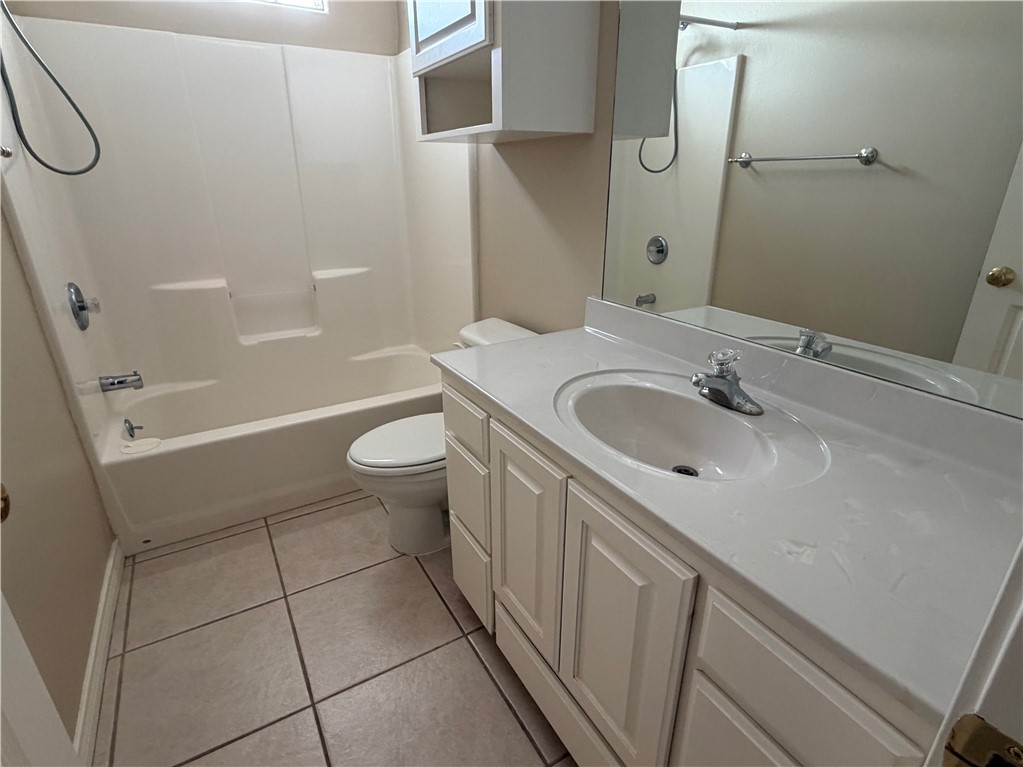 15210 Cruiser Street Corpus Christi, TX 78418 - Photo 9 of 12 a bathroom with a sink a toilet and shower