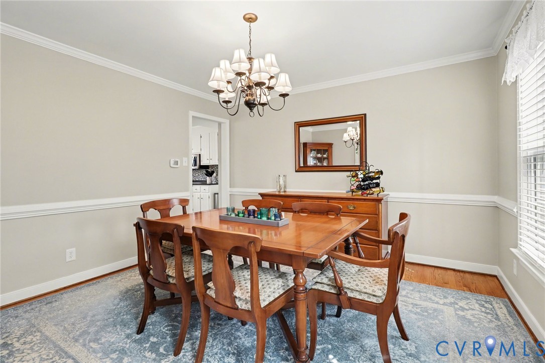 548 Glenmeadow Road Midlothian, VA 23114 - Photo 11 of 31 a view of a dining room with furniture and chandelier