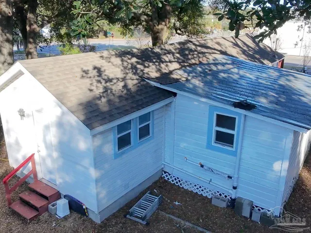 a view of a backyard of the house
