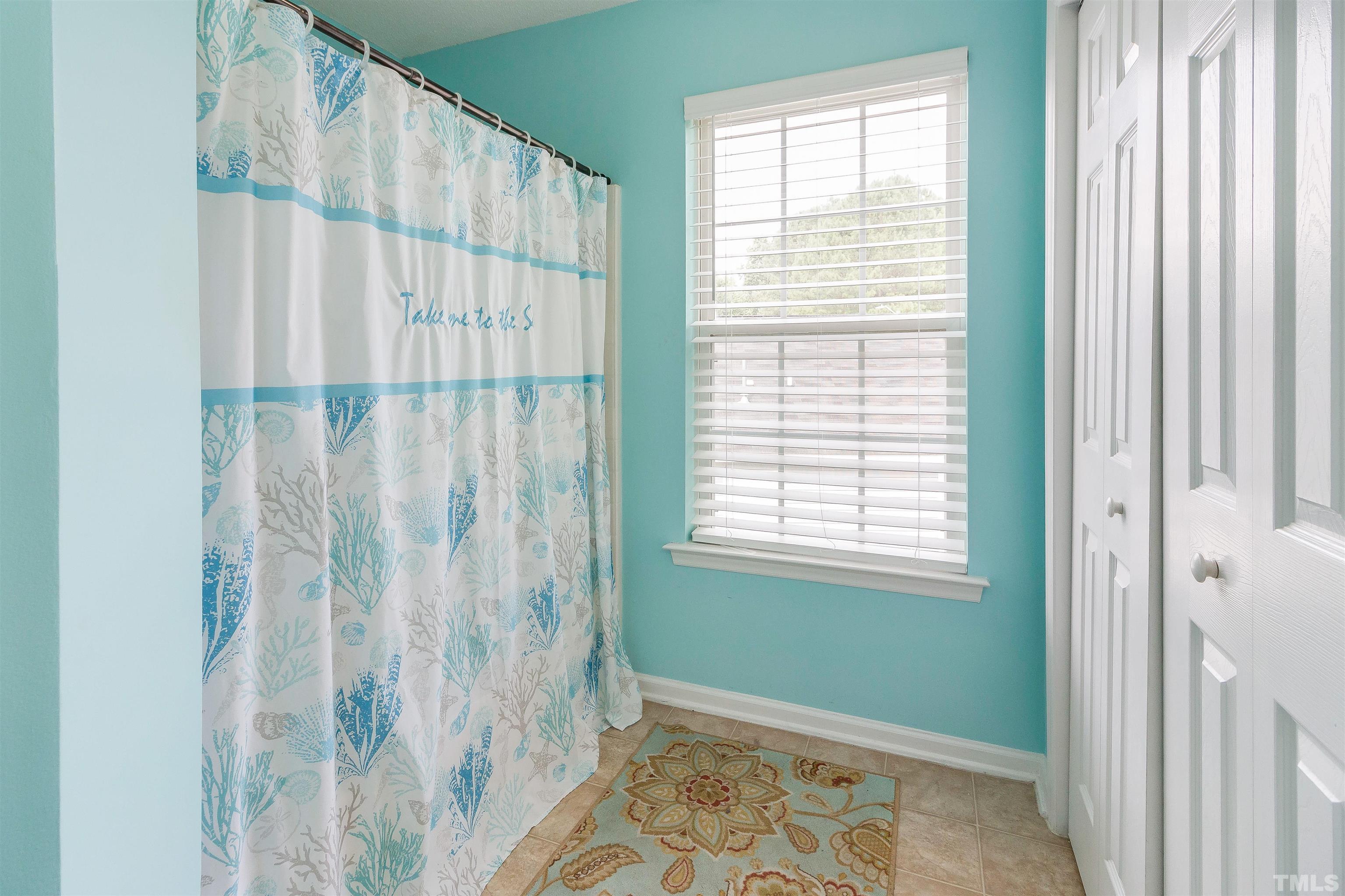 5208 Marthonna Way Raleigh, NC 27616 - Photo 15 of 17 a view of a window and a curtain