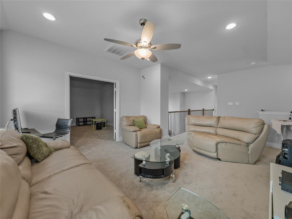 116 Chaco Drive Forney, TX 75126 - Photo 17 of 27 a living room with furniture and a ceiling fan