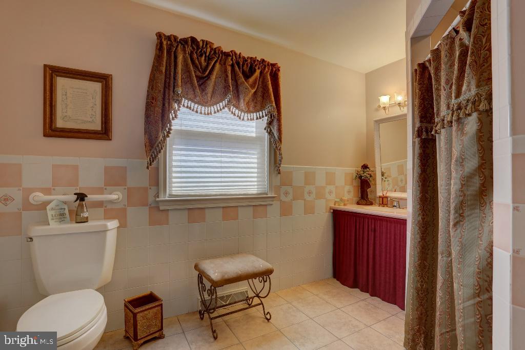 30 Pinewood Avenue Lititz, PA 17543 - Photo 12 of 73 a bathroom with a toilet a sink and mirror