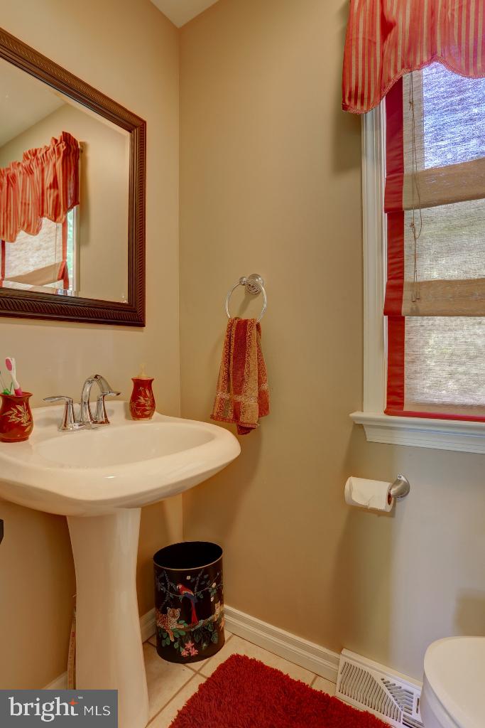 30 Pinewood Avenue Lititz, PA 17543 - Photo 27 of 73 a bathroom with a sink and a mirror