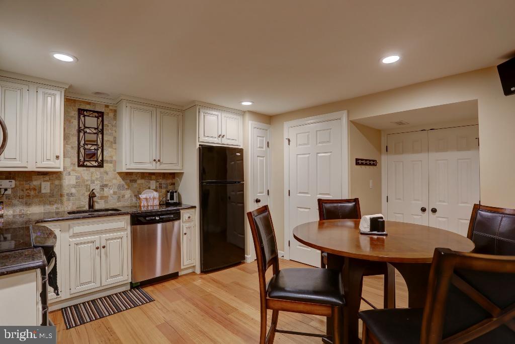 30 Pinewood Avenue Lititz, PA 17543 - Photo 34 of 73 a kitchen with a table chairs refrigerator and cabinets