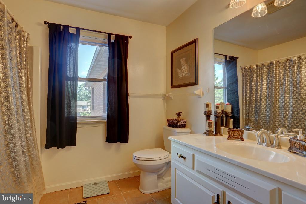30 Pinewood Avenue Lititz, PA 17543 - Photo 41 of 73 a bathroom with a granite countertop sink toilet and mirror