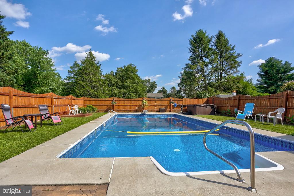 30 Pinewood Avenue Lititz, PA 17543 - Photo 55 of 73 a view of a swimming pool with a patio and a yard