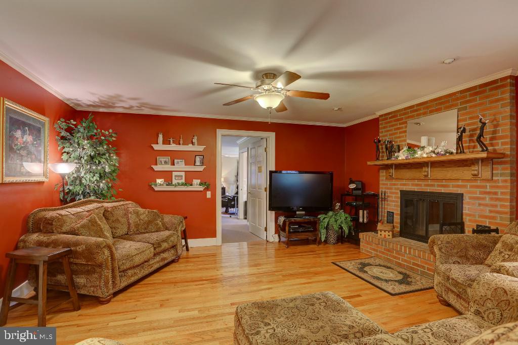 30 Pinewood Avenue Lititz, PA 17543 - Photo 8 of 73 a living room with furniture a flat screen tv and a fireplace