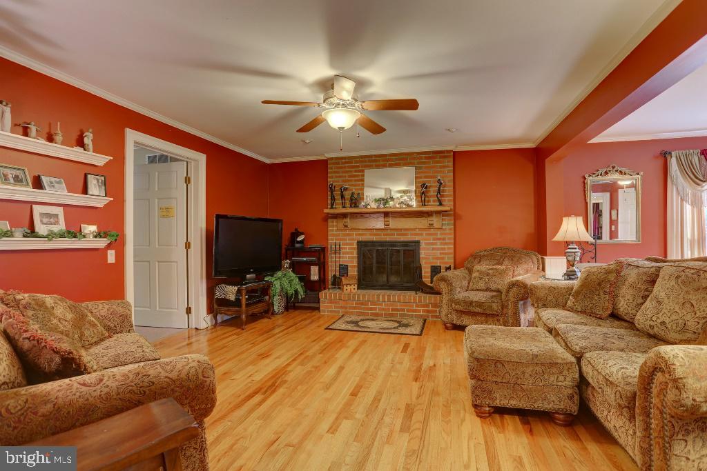 30 Pinewood Avenue Lititz, PA 17543 - Photo 10 of 73 a living room with furniture a flat screen tv and a fireplace