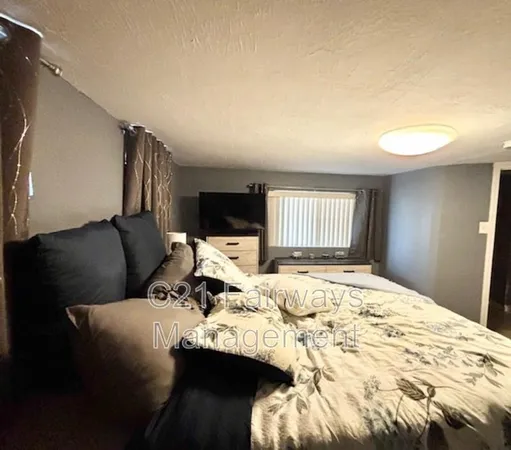 a bed room with a bed and furniture