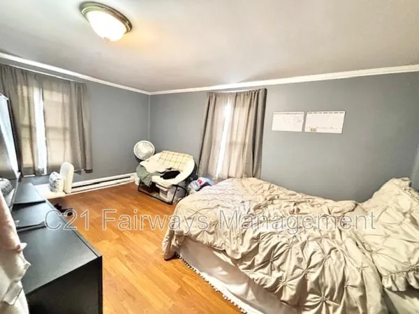 a bedroom with a bed and window