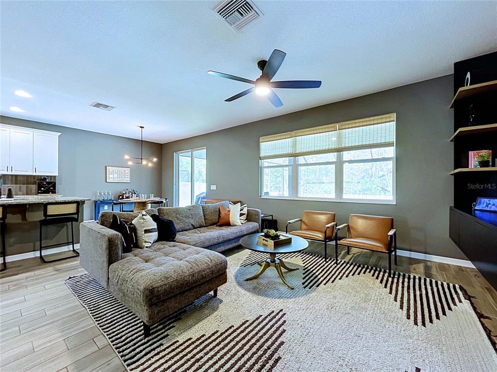 18078 Romanesque Court Spring Hill, FL 34610 - Photo 24 of 81 a living room with furniture and a window