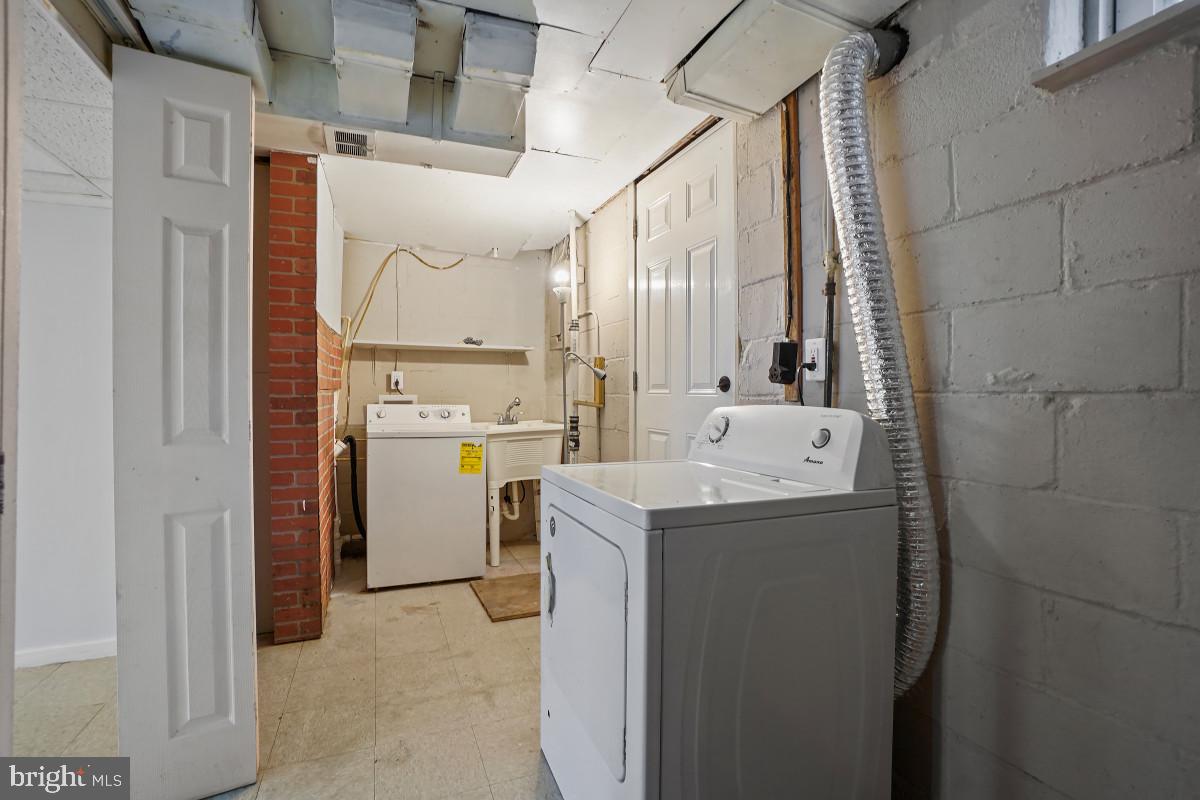 162 Cherrydell Road Baltimore, MD 21228 - Photo 29 of 31 Functional laundry space with potential.