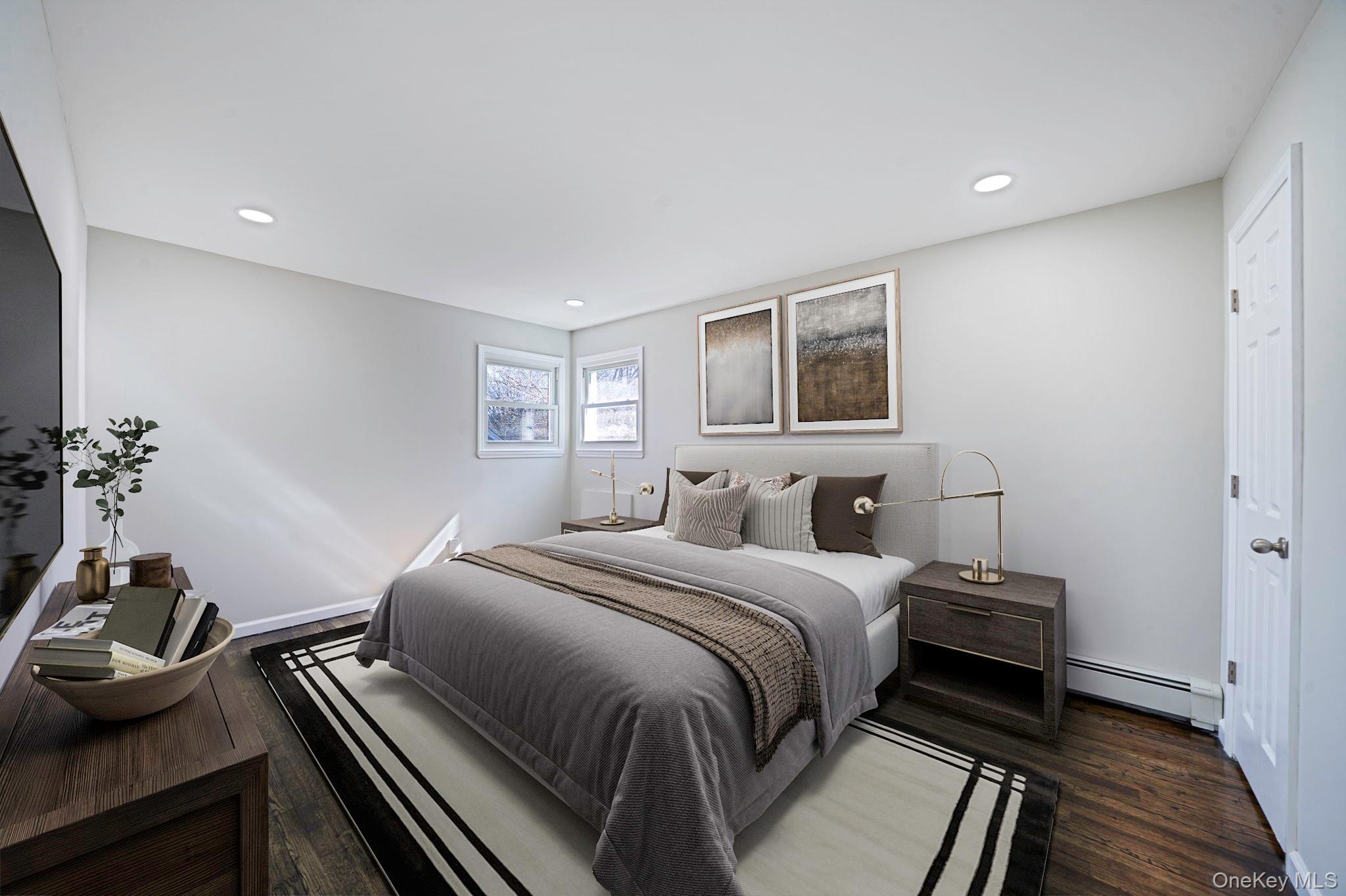 220-53 137th Road Queens, NY 11413 - Photo 11 of 41 a bedroom with a bed and wooden floor