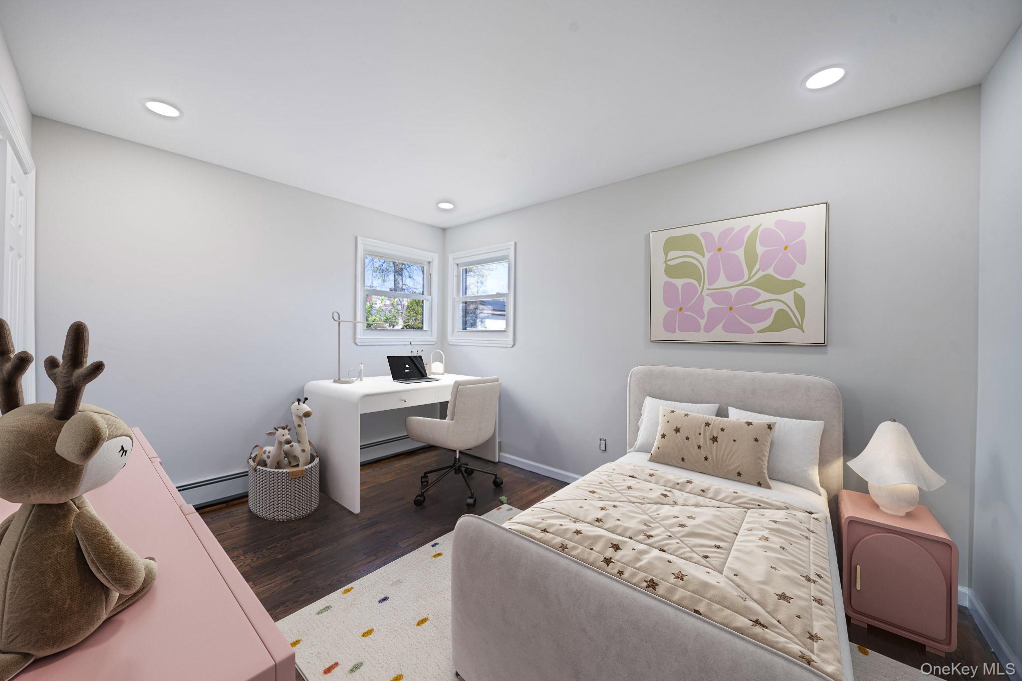 220-53 137th Road Queens, NY 11413 - Photo 13 of 41 a bedroom with a bed and wooden floor