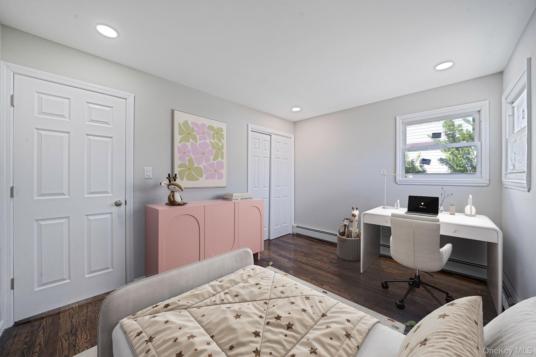 220-53 137th Road Queens, NY 11413 - Photo 14 of 41 a bedroom with a bed and wooden floor