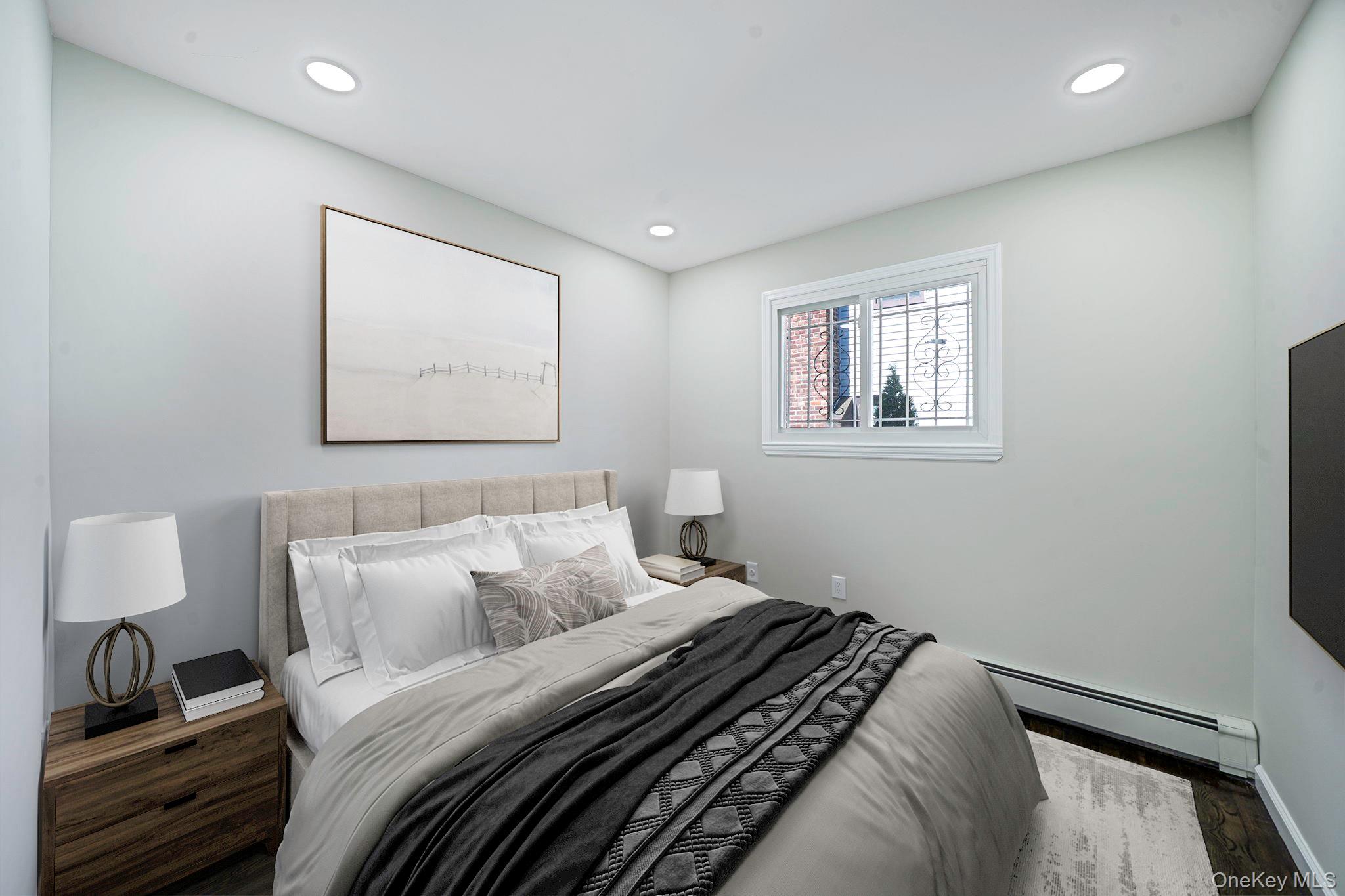 220-53 137th Road Queens, NY 11413 - Photo 16 of 41 a bedroom with a bed and a window