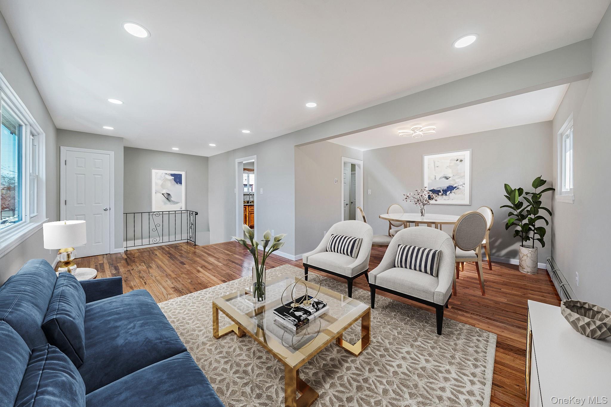 220-53 137th Road Queens, NY 11413 - Photo 17 of 41 a living room with furniture and wooden floor