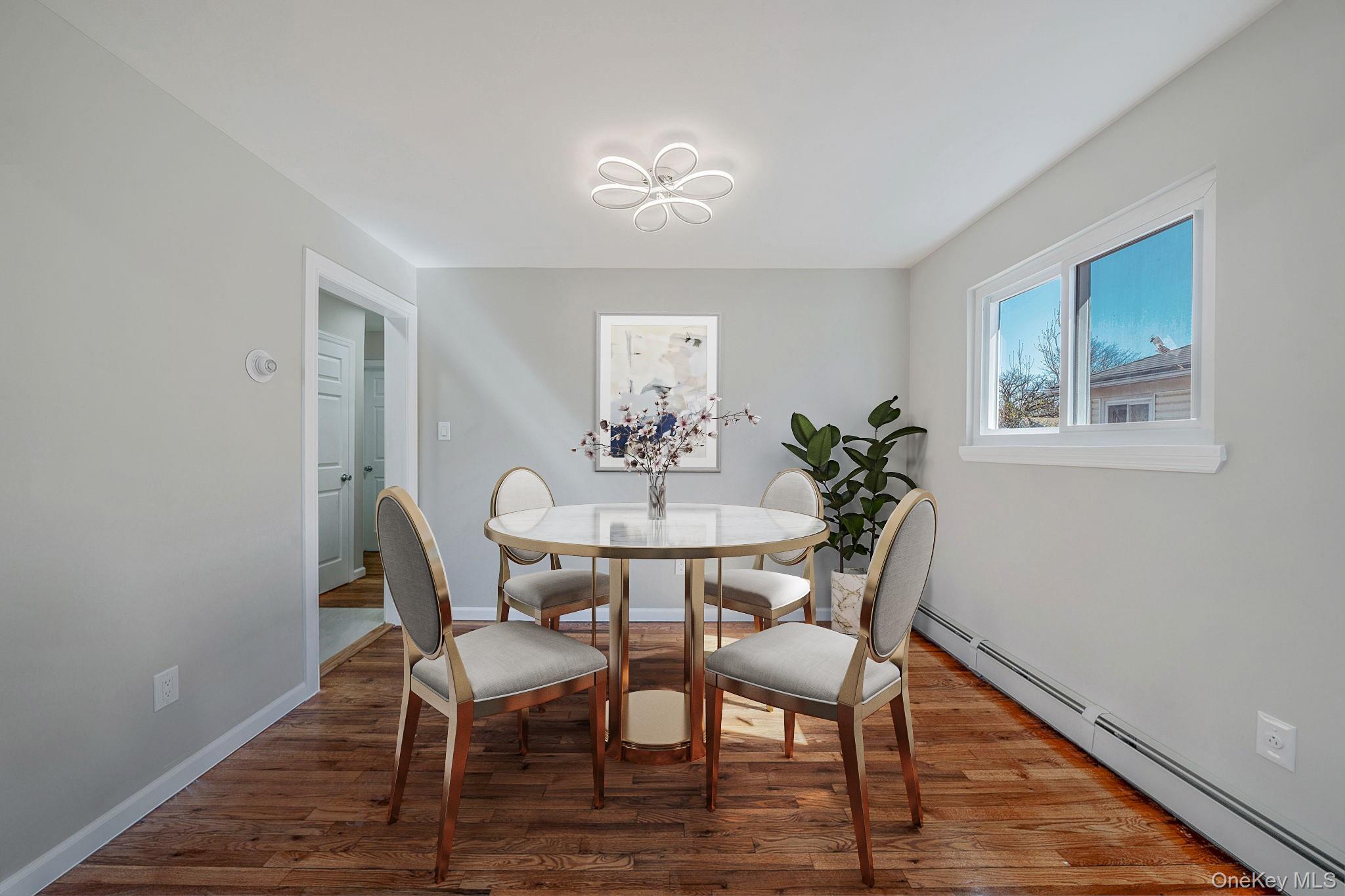 220-53 137th Road Queens, NY 11413 - Photo 18 of 41 a view of a dining room with furniture and wooden floor
