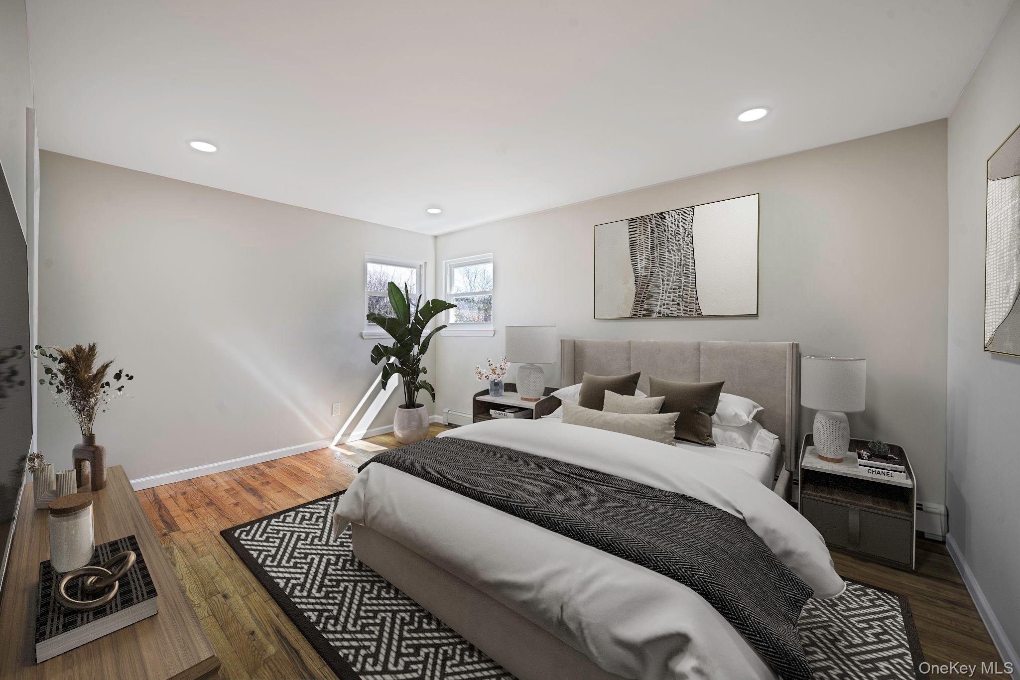 220-53 137th Road Queens, NY 11413 - Photo 21 of 41 a bedroom with a bed and wooden floor