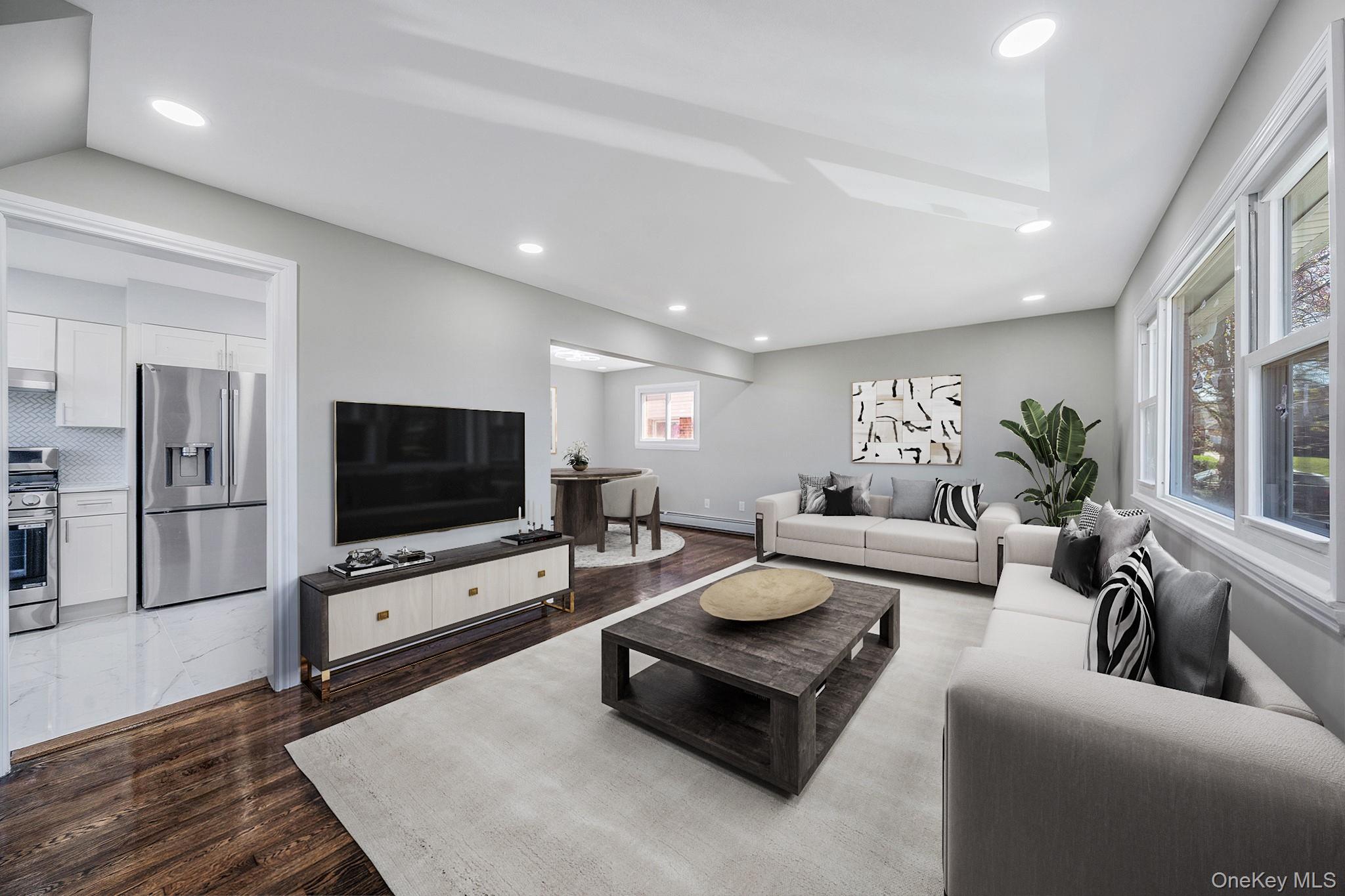 220-53 137th Road Queens, NY 11413 - Photo 4 of 41 a living room with furniture and a flat screen tv