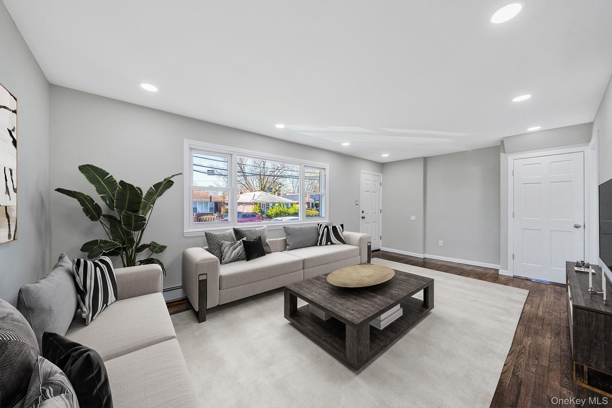 220-53 137th Road Queens, NY 11413 - Photo 5 of 41 a living room with furniture and wooden floor