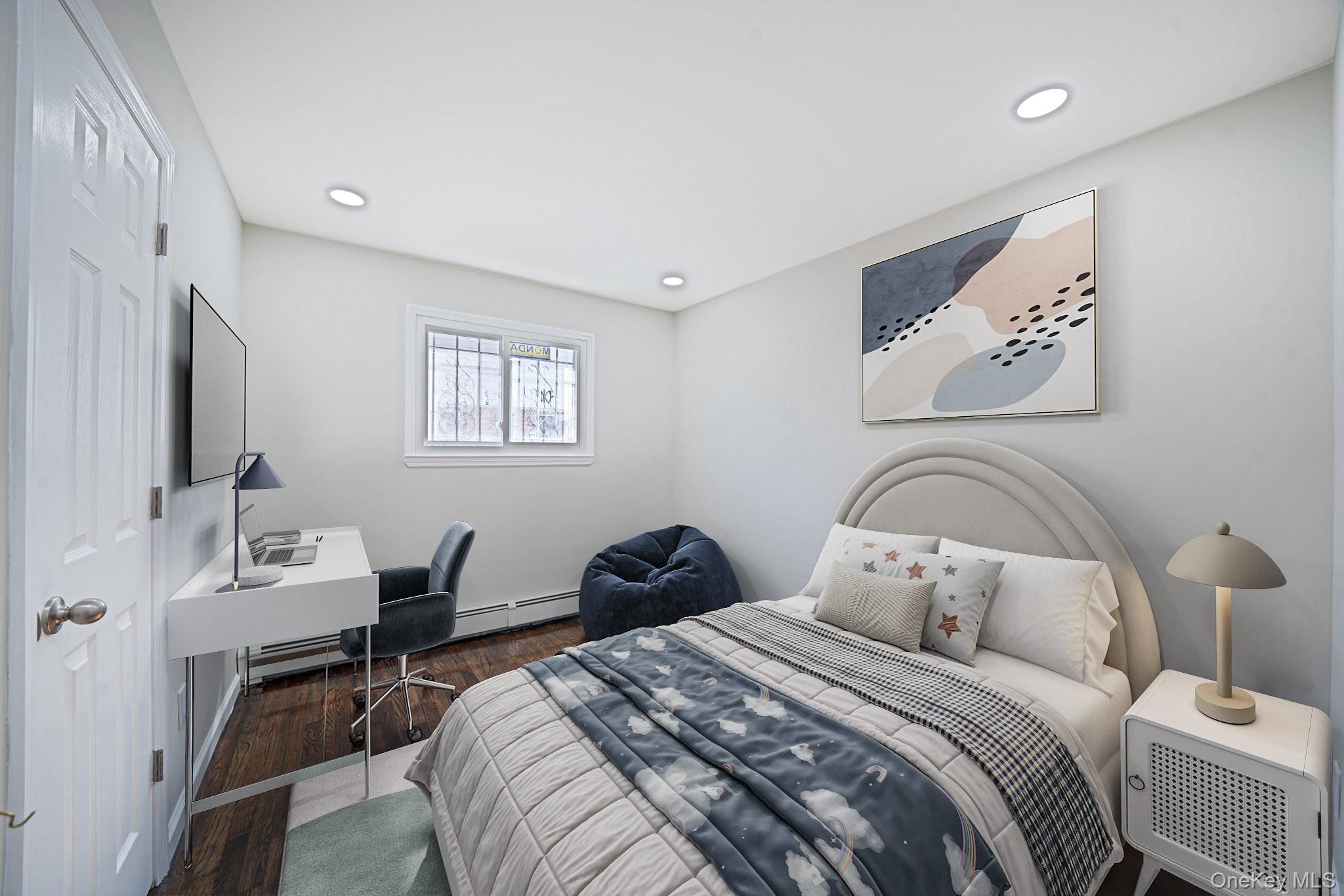 220-53 137th Road Queens, NY 11413 - Photo 8 of 41 a bedroom with a bed and a table