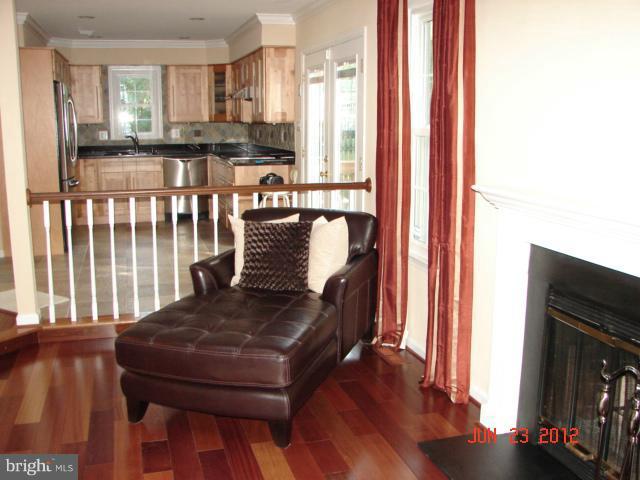 10414 Mountain Quail Road Silver Spring, MD 20901 - Photo 2 of 22 a view of a dining room with furniture and wooden floor